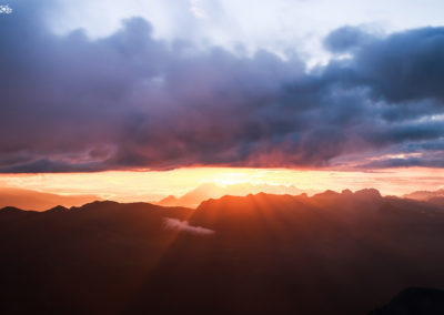 sexten - clouds - dolomites - sunlight - red - mountains - power - love